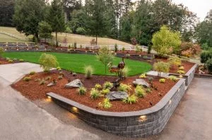 Landscaped garden framed by a curved retaining wall.
