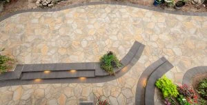 Detailed curved paver pattern with a built-in planting area.