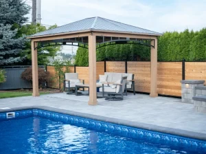 Poolside paver patio with a covered outdoor seating area.